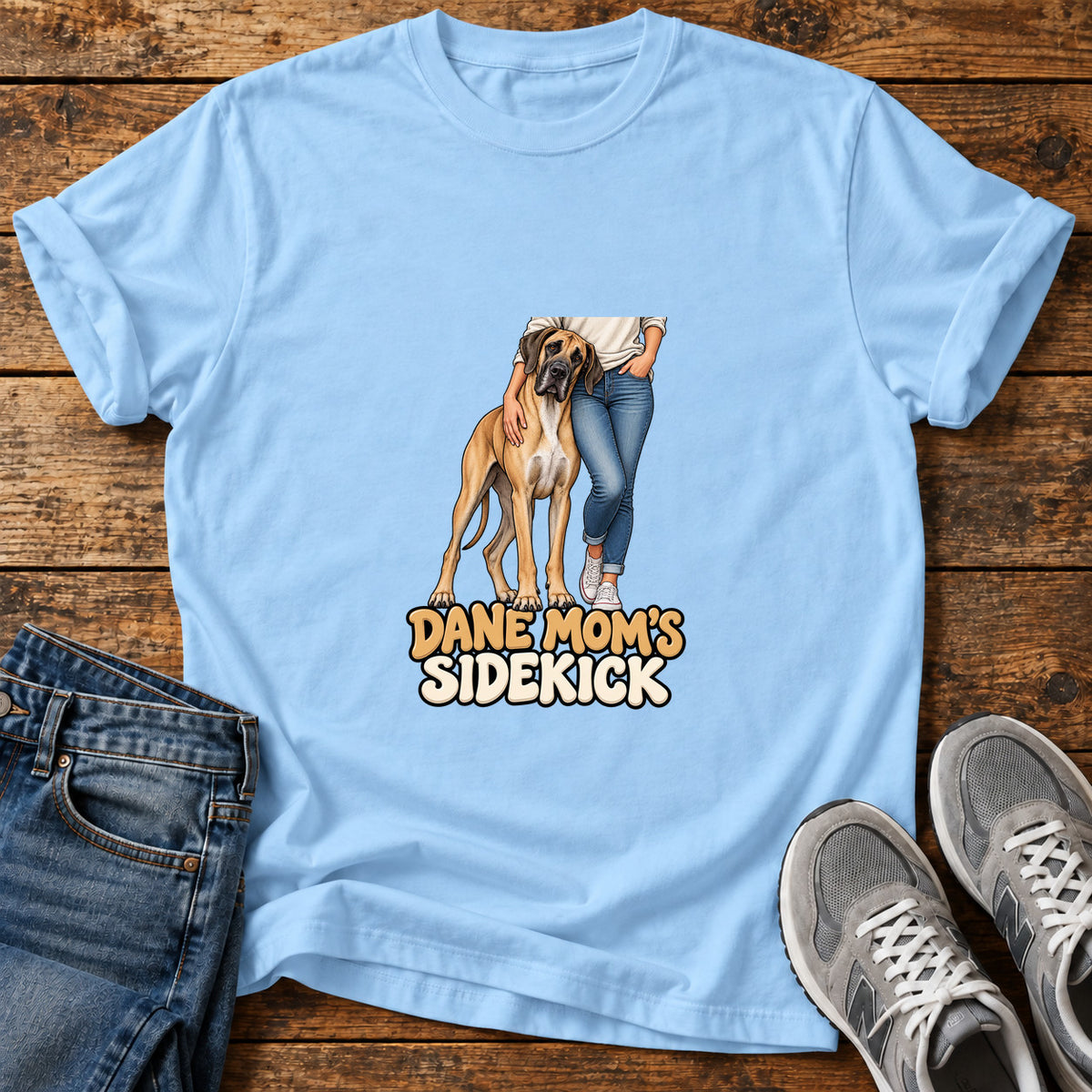 Dane Mom's Sidekick Great Dane graphic T-shirt in Light Blue, shown on a flat-lay shirt mockup