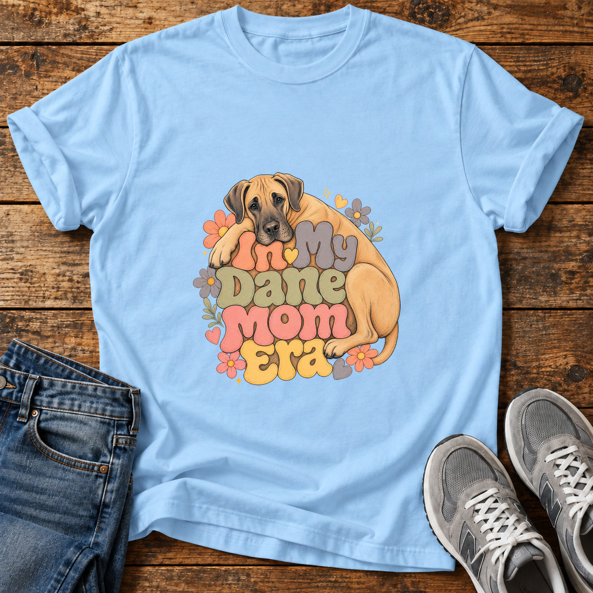 Dane Mom Era Great Dane graphic T-shirt in Light Blue, shown on a flat-lay shirt mockup