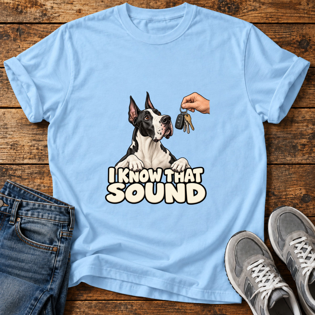 I Know Sound Great Dane graphic T-shirt in Light Blue, shown on a flat-lay shirt mockup