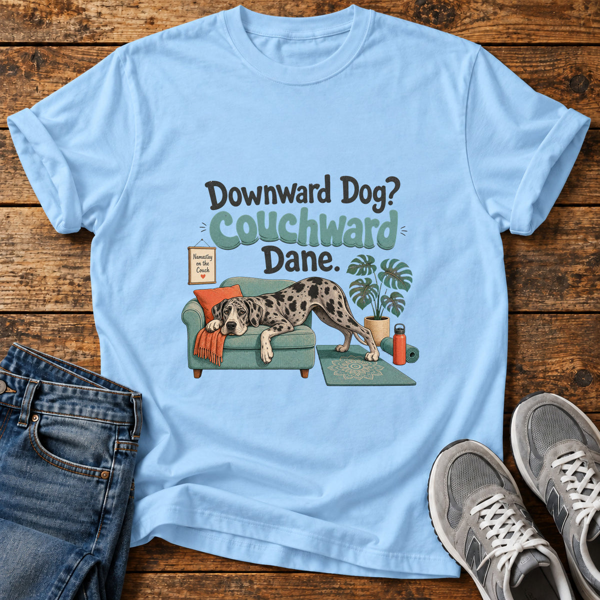 Couchward Dane Great Dane graphic T-shirt in Light Blue, shown on a flat-lay shirt mockup