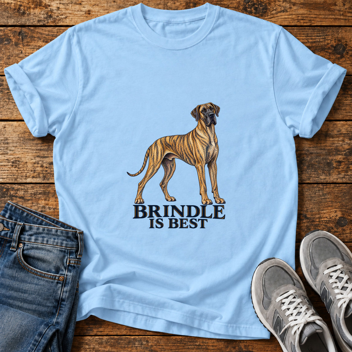 Brindle Is Best Great Dane graphic T-shirt in Light Blue, shown on a flat-lay shirt mockup