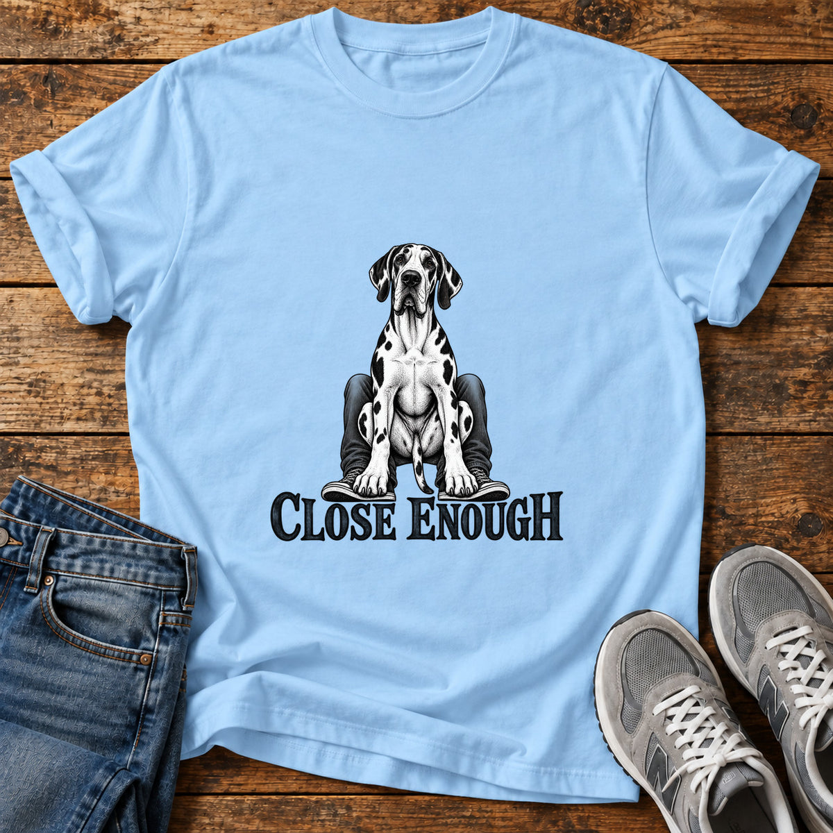 Close Enough Great Dane graphic T-shirt in Light Blue, shown on a flat-lay shirt mockup