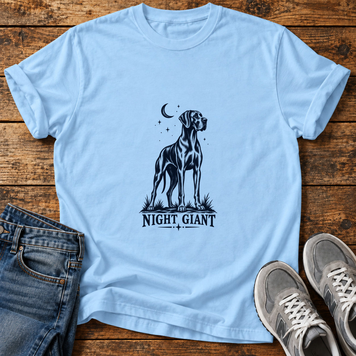 Night Giant Great Dane graphic T-shirt in Light Blue, shown on a flat-lay shirt mockup
