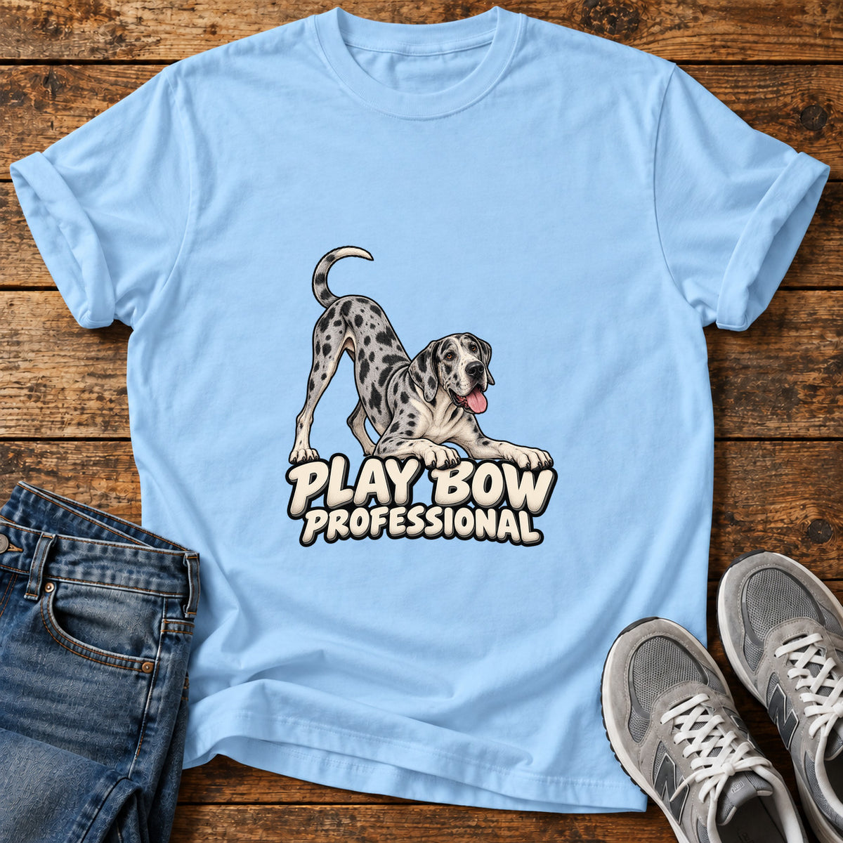 Play Bow Pro Great Dane graphic T-shirt in Light Blue, shown on a flat-lay shirt mockup