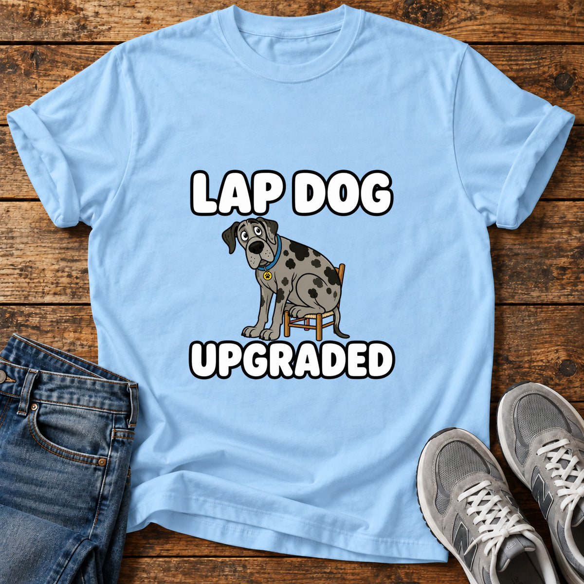 Lap Dog Upgraded Great Dane graphic T-shirt in Light Blue, shown on a flat-lay shirt mockup