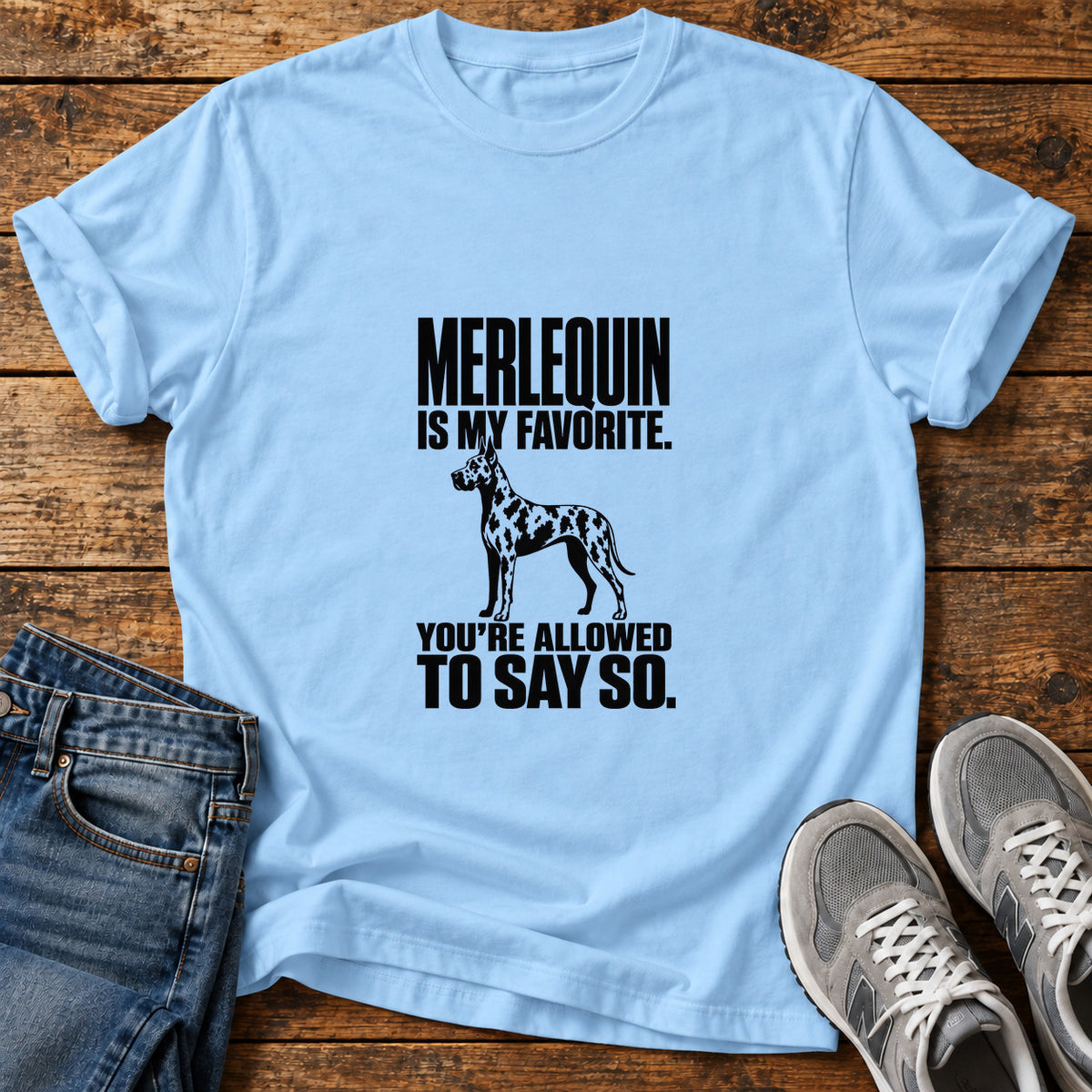 Merlequin Favorite Great Dane graphic T-shirt in Light Blue, shown on a flat-lay shirt mockup