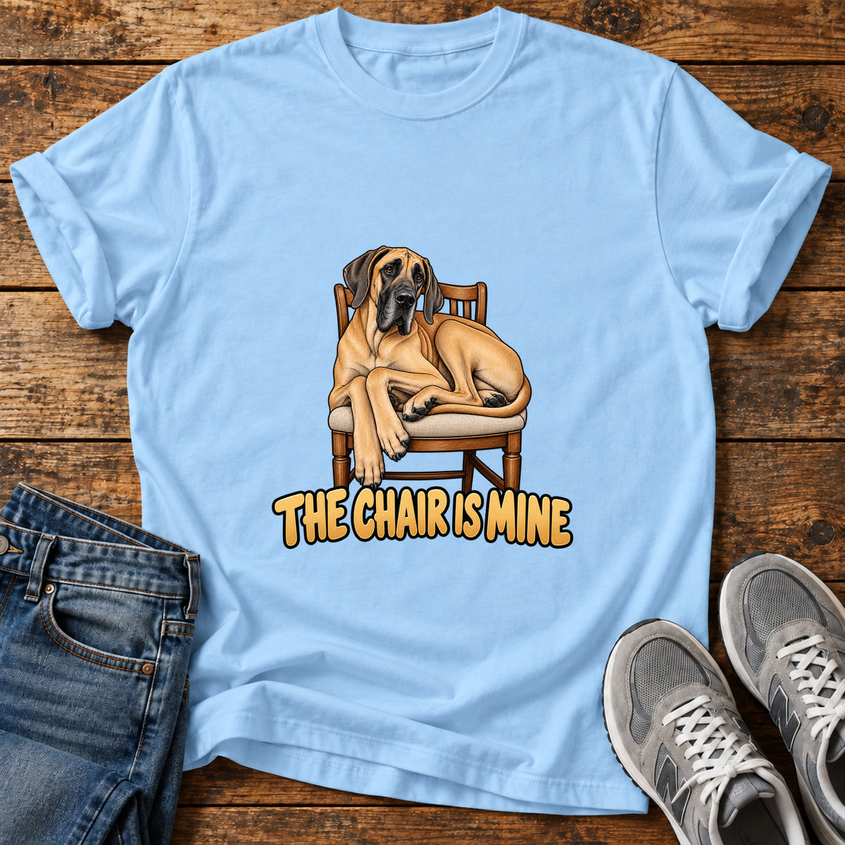 The Chair Great Dane graphic T-shirt in Light Blue, shown on a flat-lay shirt mockup