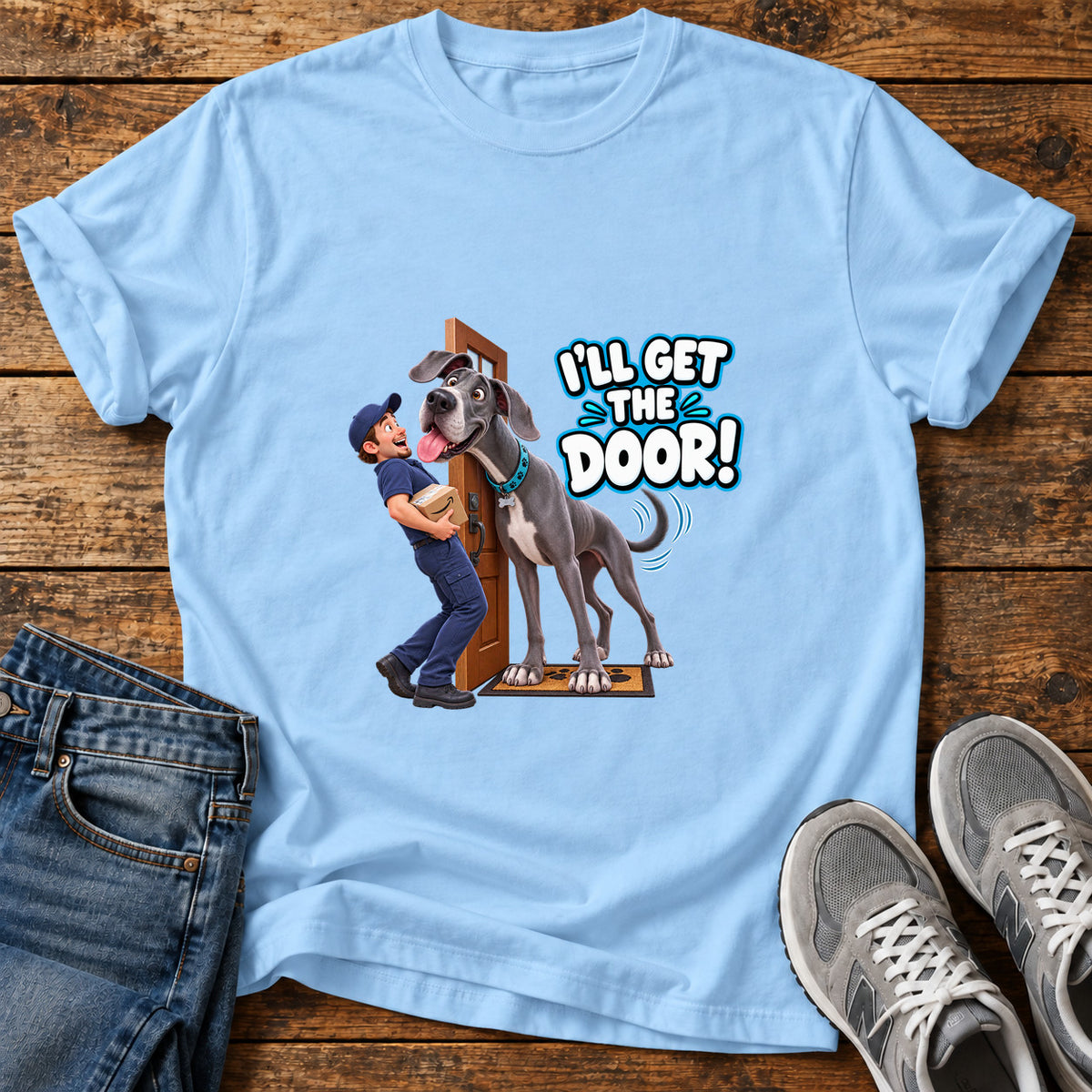 Get The Door Great Dane graphic T-shirt in Light Blue, shown on a flat-lay shirt mockup