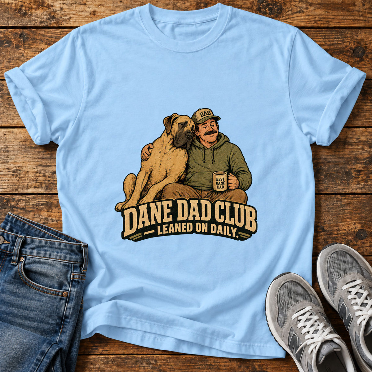 Dane Dad Club Great Dane graphic T-shirt in Light Blue, shown on a flat-lay shirt mockup