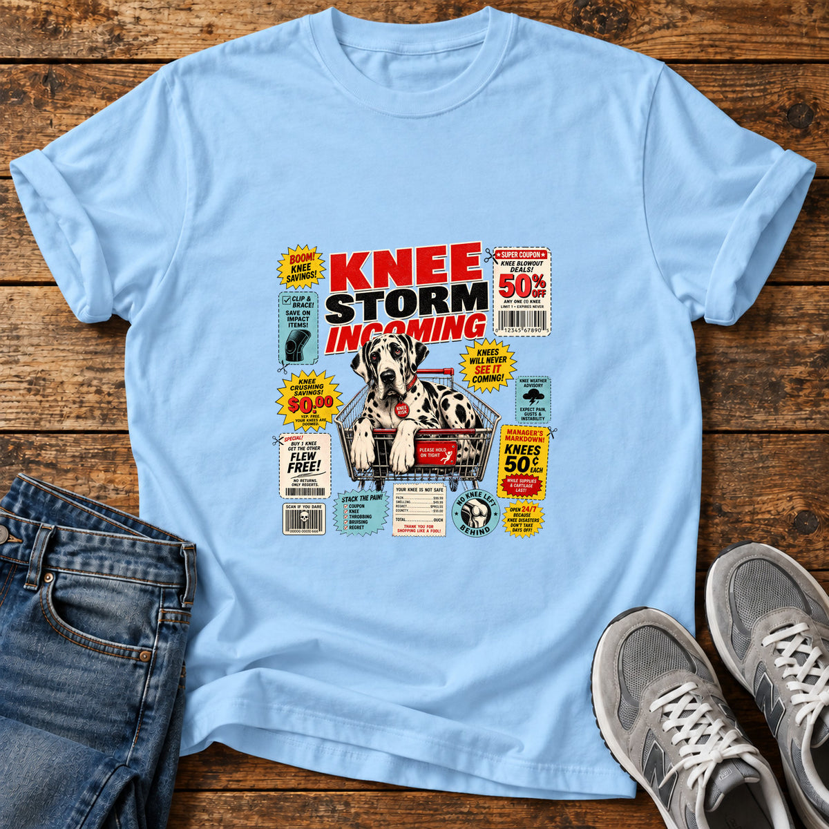 Knee Storm Incoming Great Dane graphic T-shirt in Light Blue, shown on a flat-lay shirt mockup