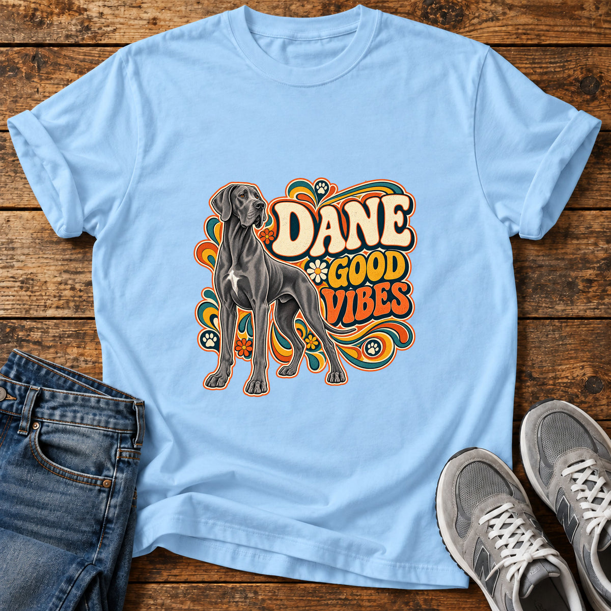 Dane Good Vibes Great Dane graphic T-shirt in Light Blue, shown on a flat-lay shirt mockup