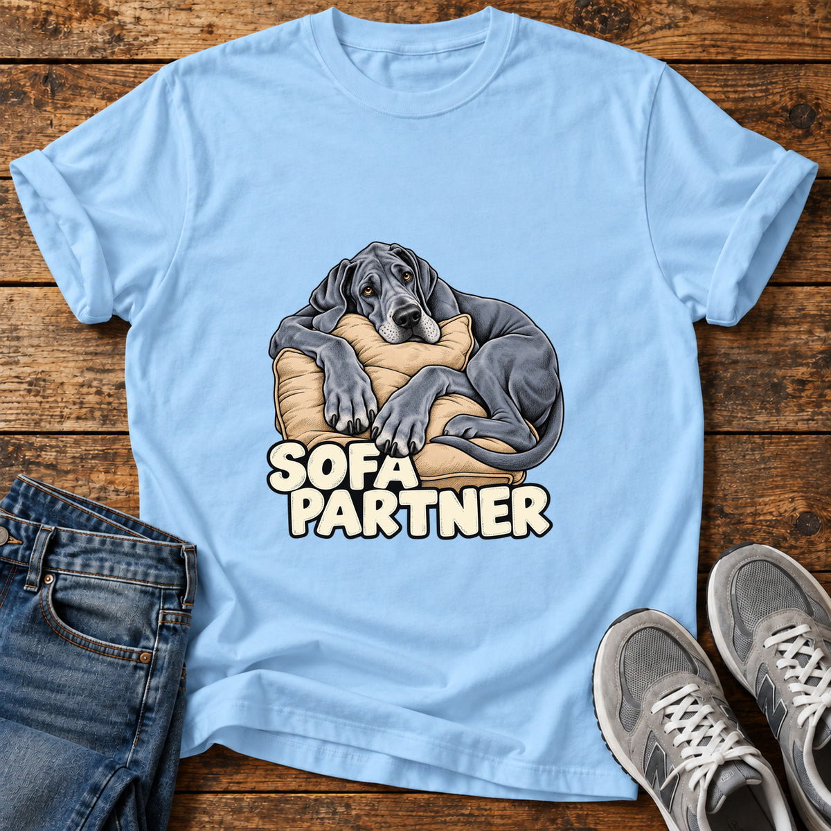 Sofa Partner Great Dane graphic T-shirt in Light Blue, shown on a flat-lay shirt mockup