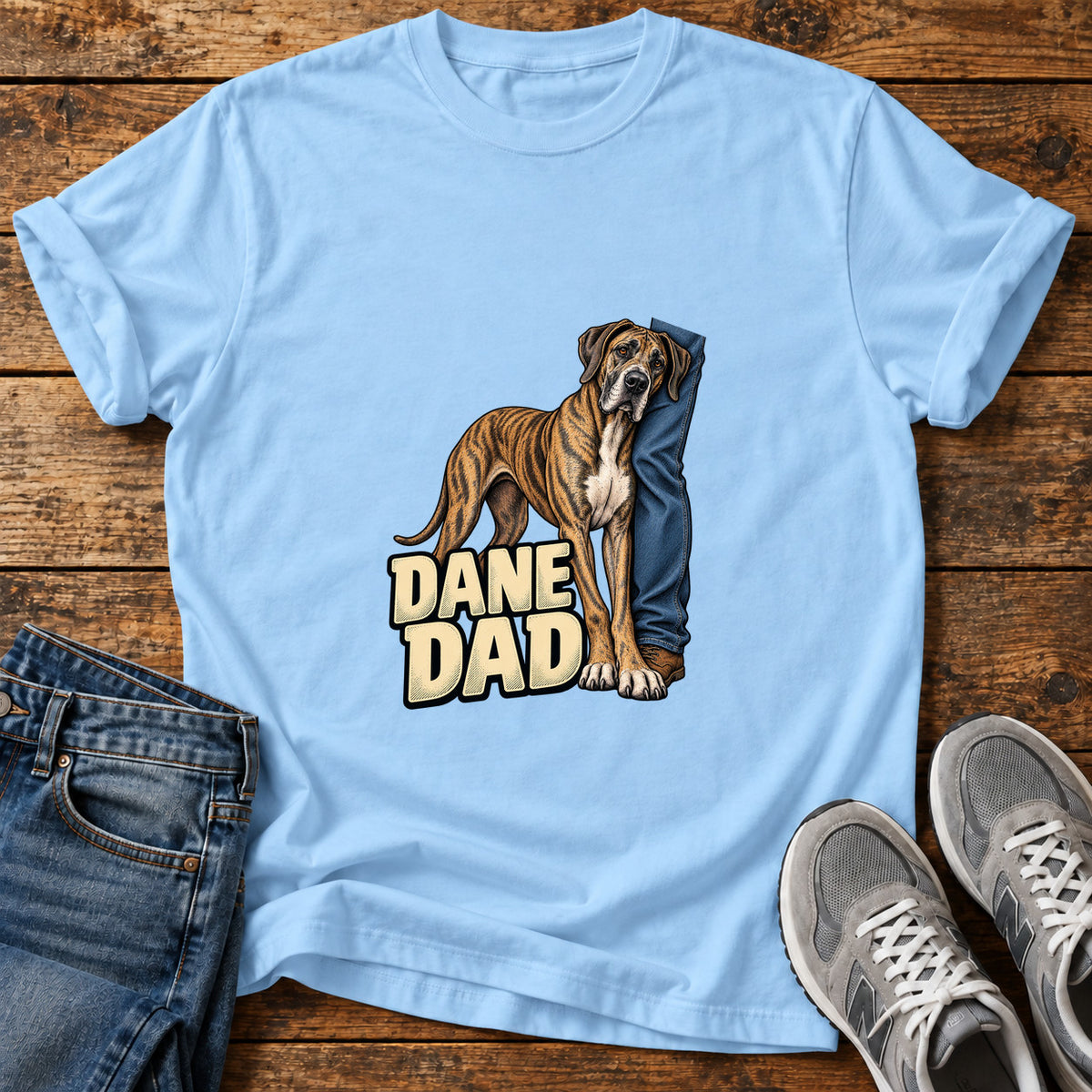 Dane Dad Great Dane graphic T-shirt in Light Blue, shown on a flat-lay shirt mockup