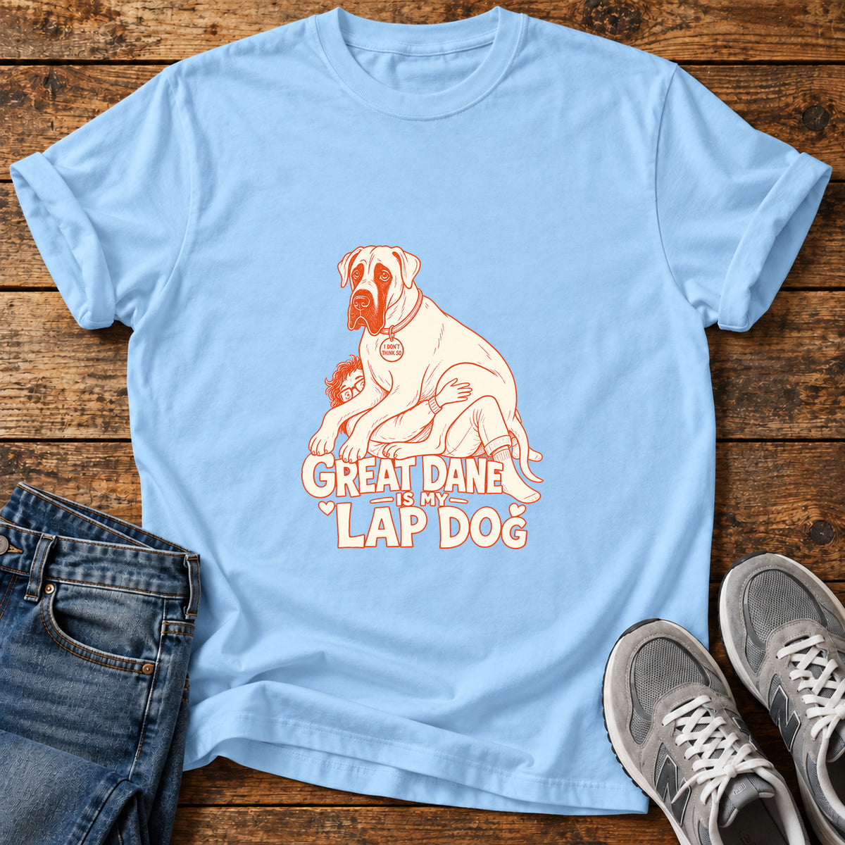 Great Dane Lapdog graphic T-shirt in Light Blue, shown on a flat-lay shirt mockup