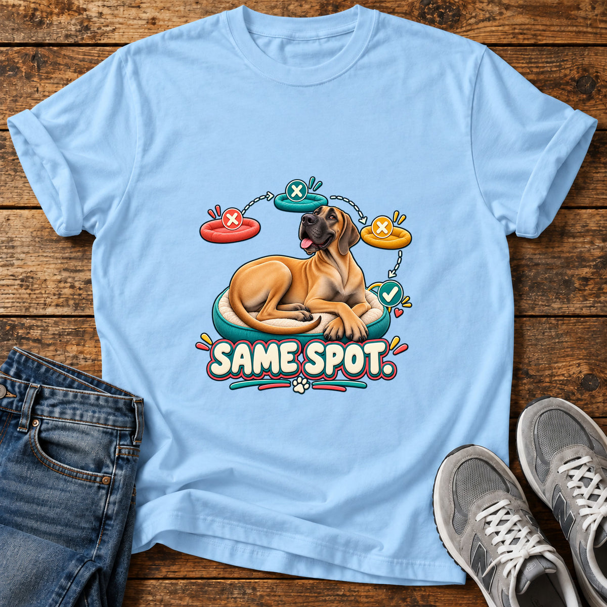 Same Spot Great Dane graphic T-shirt in Light Blue, shown on a flat-lay shirt mockup