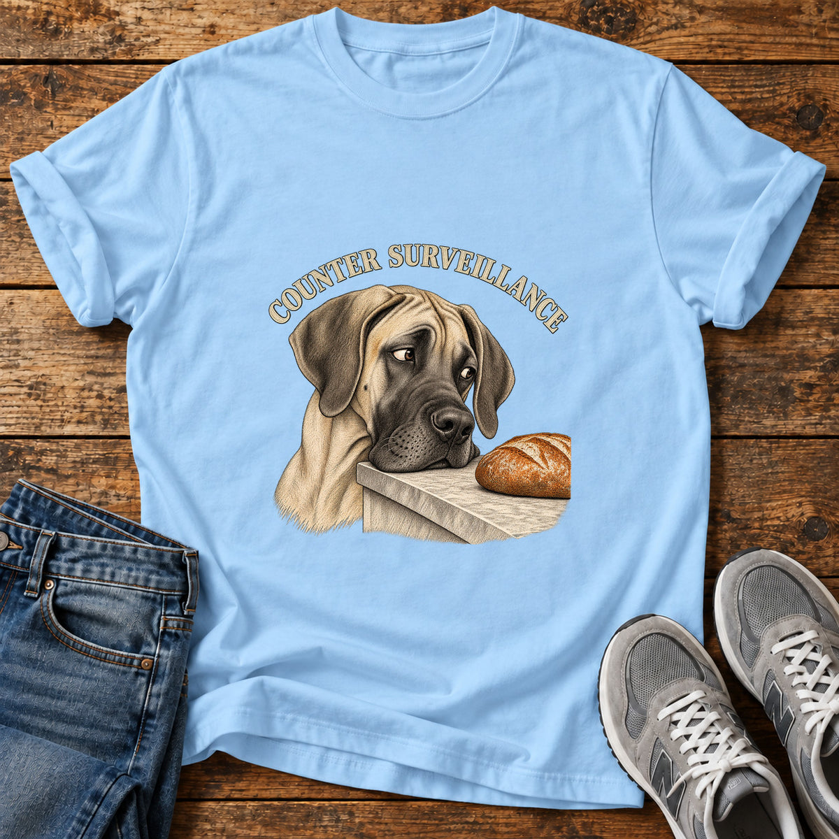 Counter Surveillance Great Dane graphic T-shirt in Light Blue, shown on a flat-lay shirt mockup