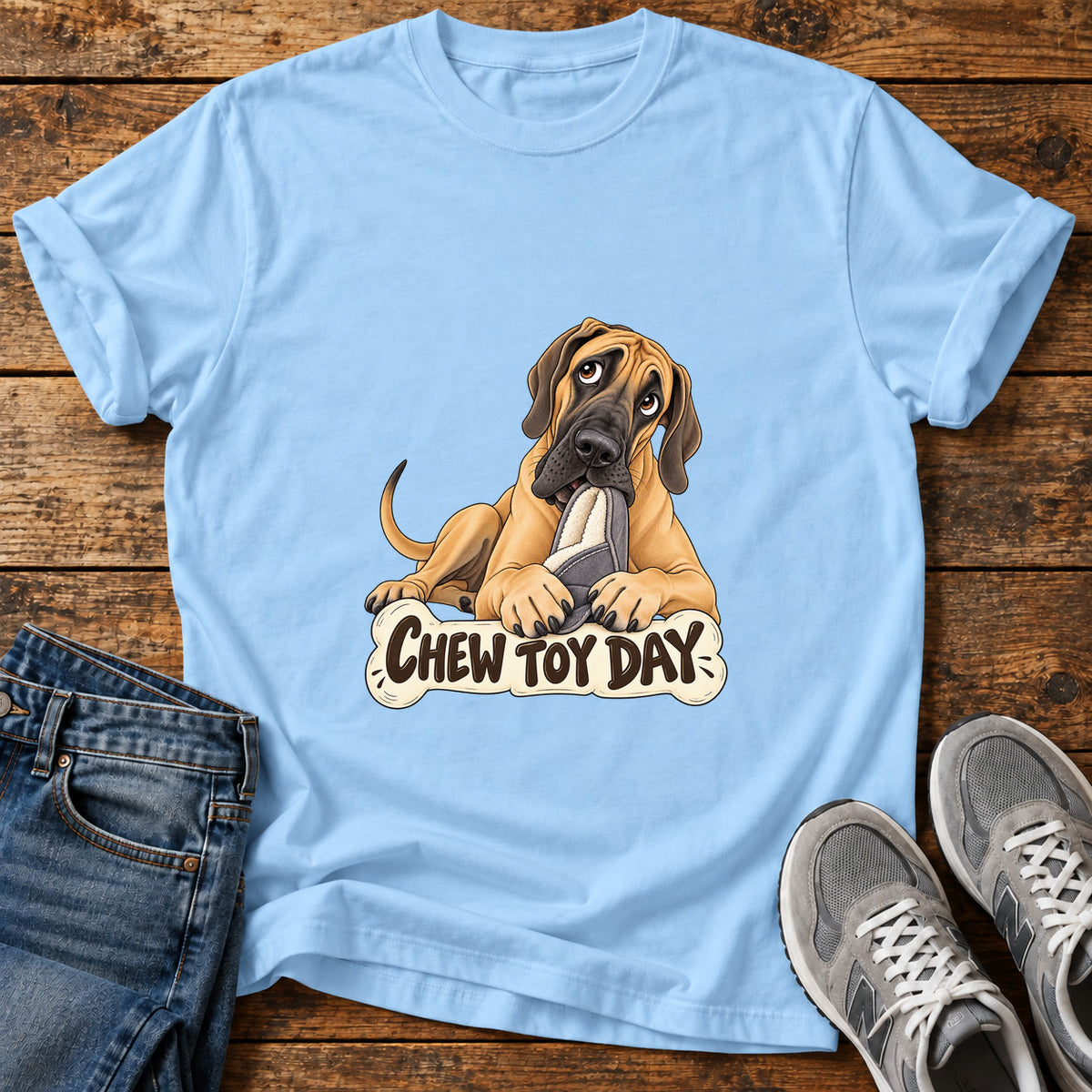 Chew Toy Day Great Dane graphic T-shirt in Light Blue, shown on a flat-lay shirt mockup