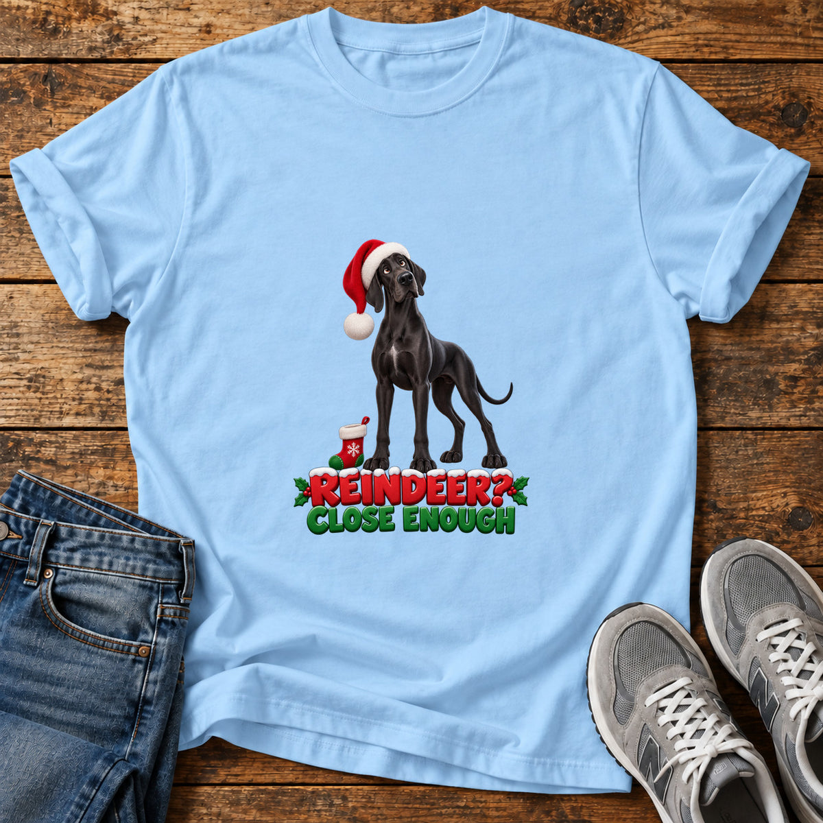 Reindeer Close Enough Great Dane graphic T-shirt in Light Blue, shown on a flat-lay shirt mockup