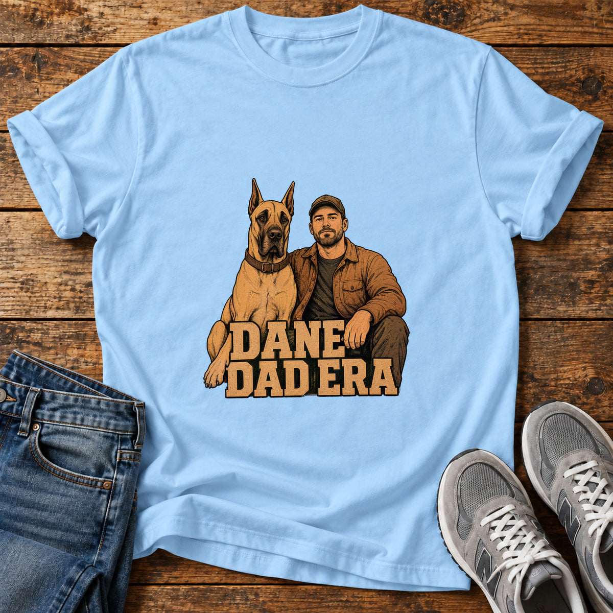 Dane Dad Era Great Dane graphic T-shirt in Light Blue, shown on a flat-lay shirt mockup