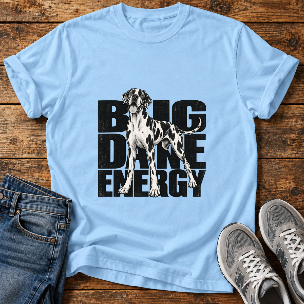 Big Dane Energy Great Dane graphic T-shirt in Light Blue, shown on a flat-lay shirt mockup