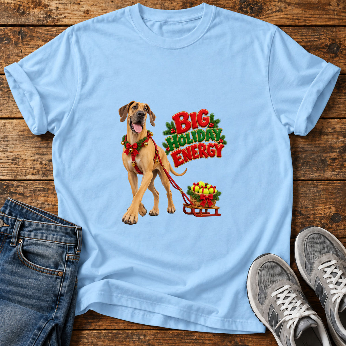 Big Holiday Energy Great Dane graphic T-shirt in Light Blue, shown on a flat-lay shirt mockup