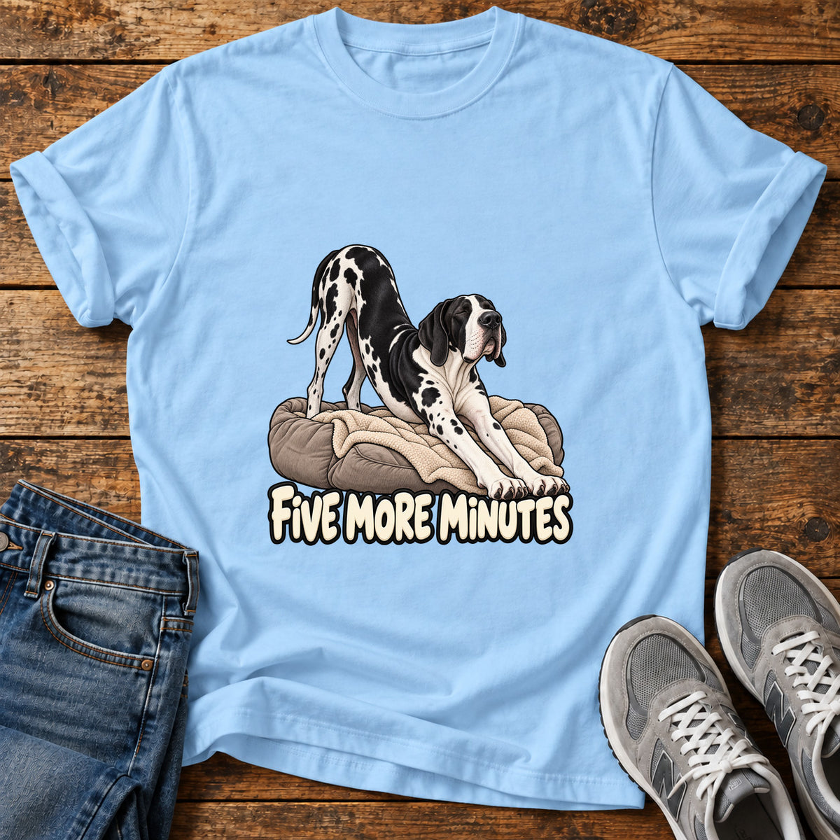 Five More Minutes Great Dane graphic T-shirt in Light Blue, shown on a flat-lay shirt mockup