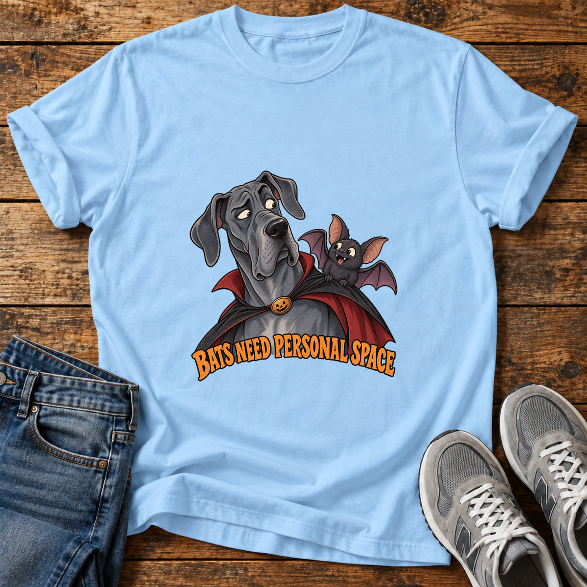 Bats Need Space Great Dane graphic T-shirt in Light Blue, shown on a flat-lay shirt mockup