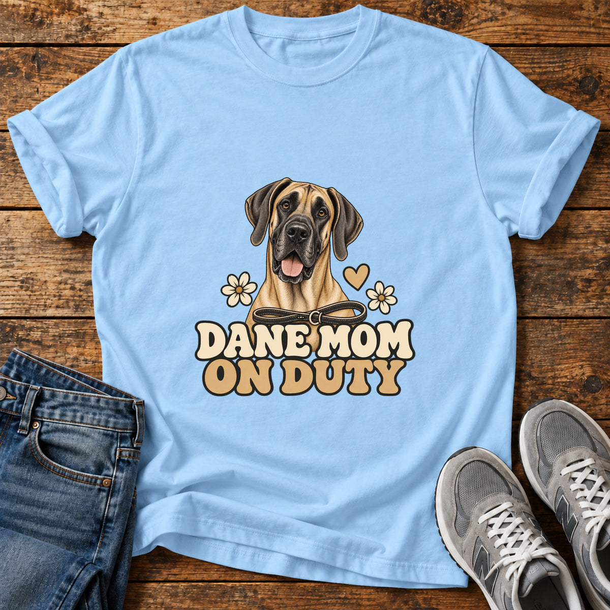 Dane Mom Duty Great Dane graphic T-shirt in Light Blue, shown on a flat-lay shirt mockup