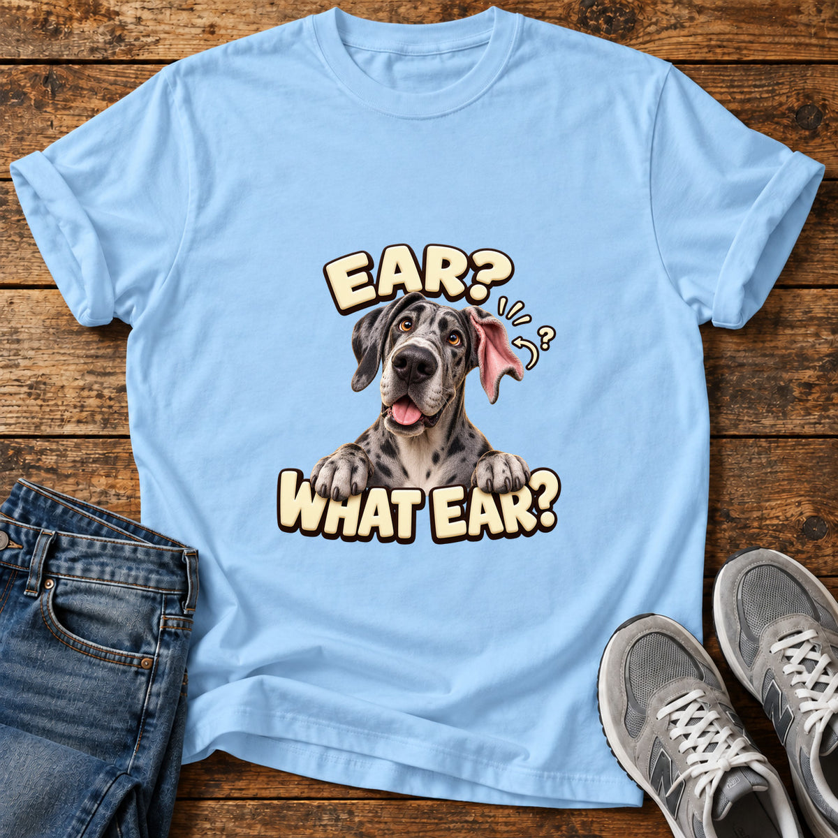 Ear What Ear Great Dane graphic T-shirt in Light Blue, shown on a flat-lay shirt mockup