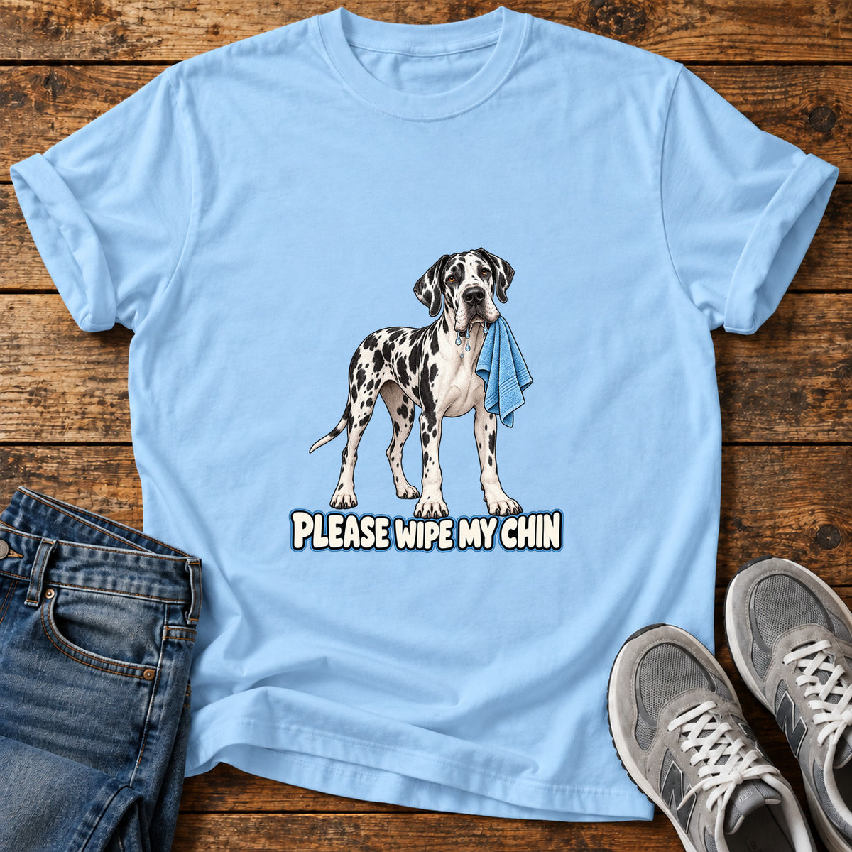 Wipe My Chin Great Dane graphic T-shirt in Light Blue, shown on a flat-lay shirt mockup