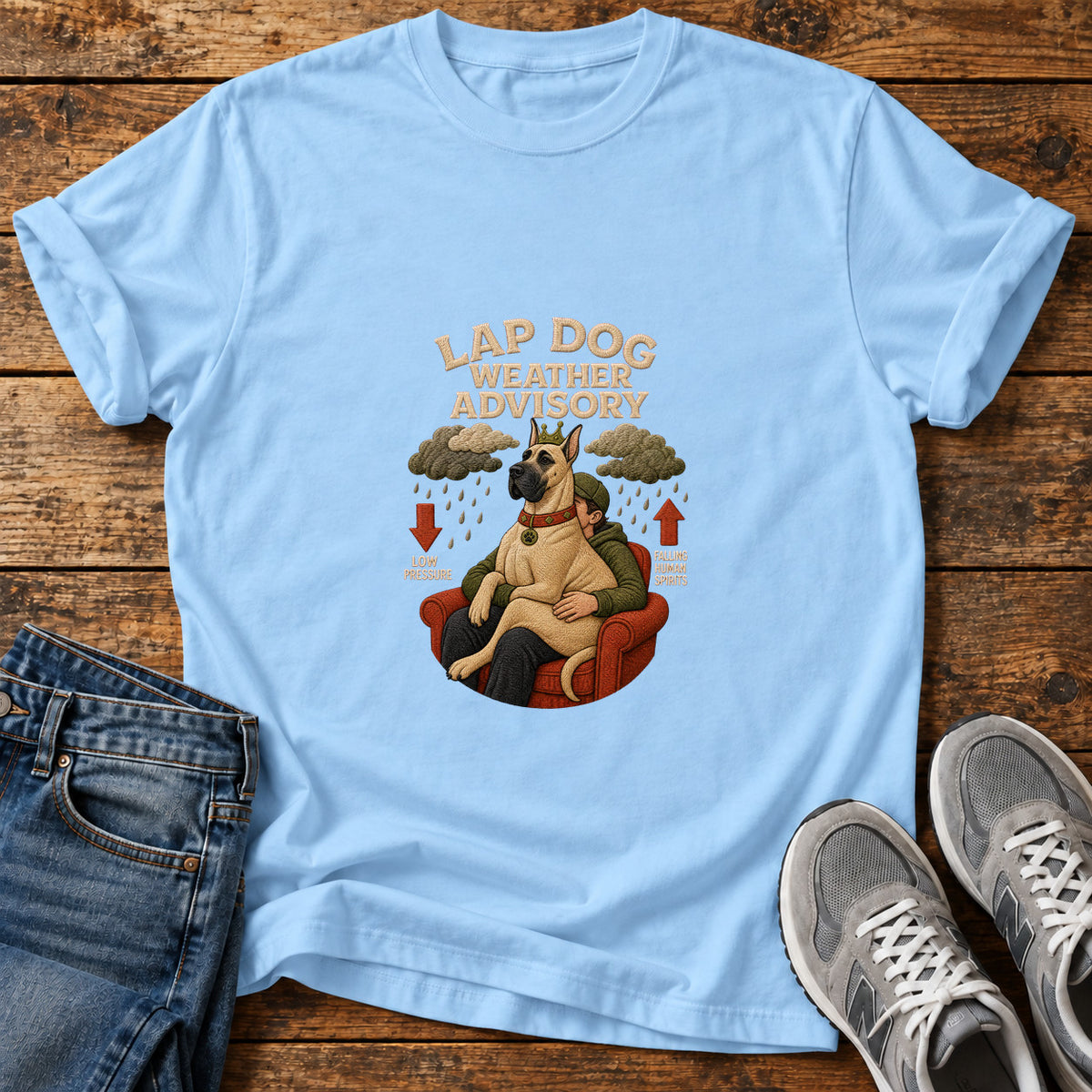 Lap Dog Weather Great Dane graphic T-shirt in Light Blue, shown on a flat-lay shirt mockup