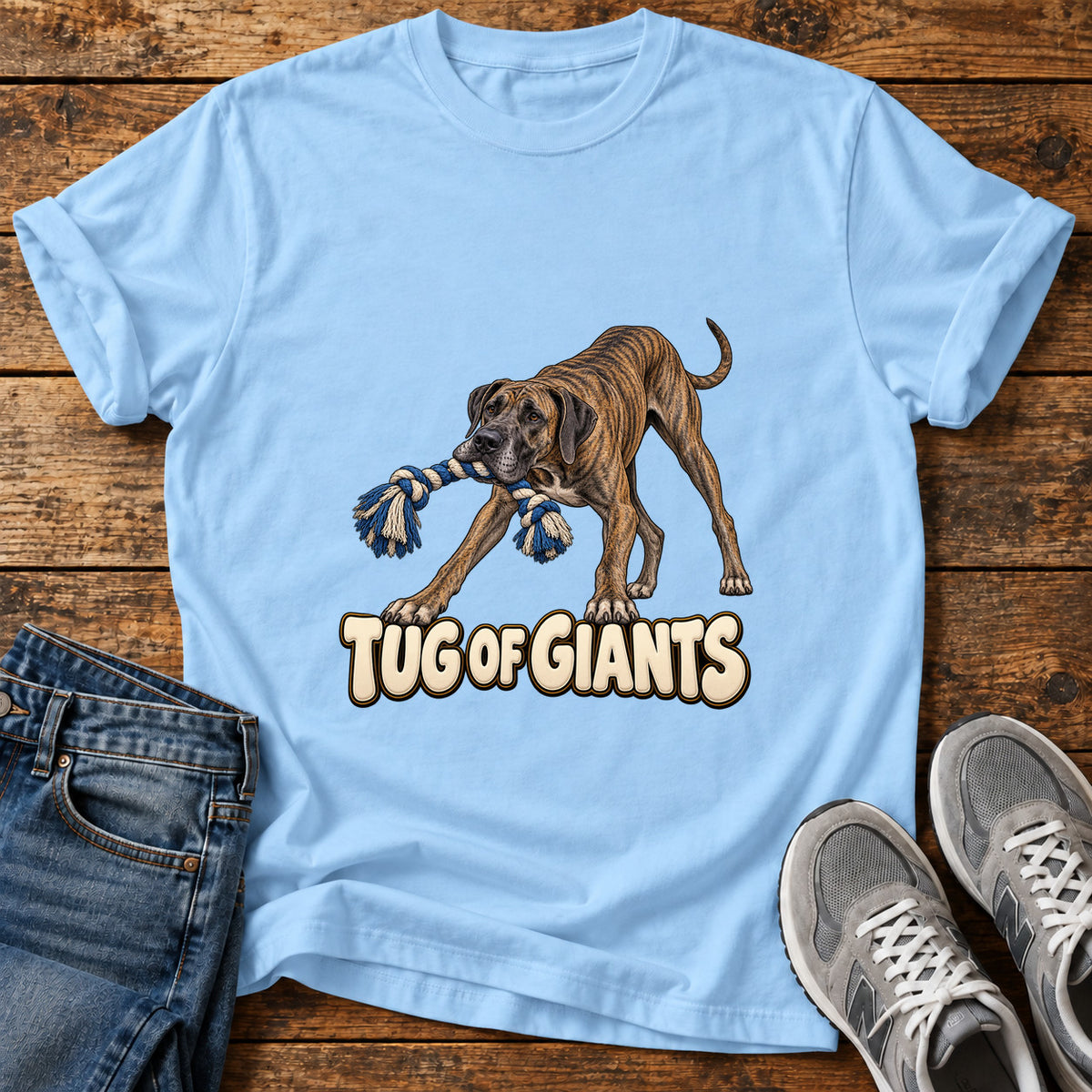 Tug of Giants Great Dane graphic T-shirt in Light Blue, shown on a flat-lay shirt mockup