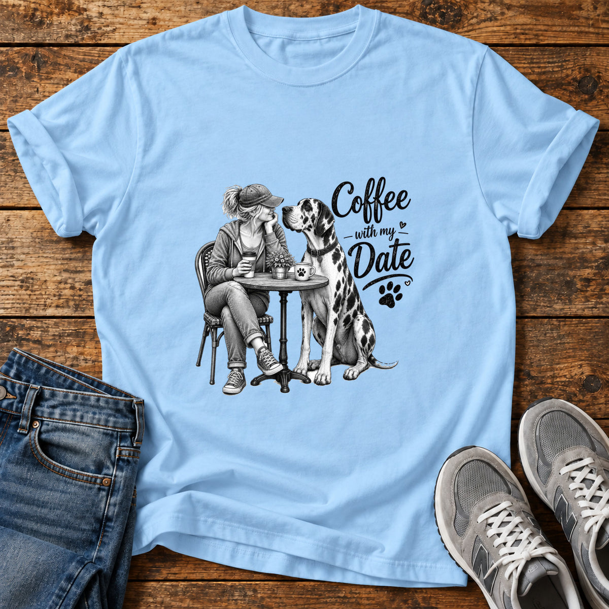 Coffee Date Paws Great Dane graphic T-shirt in Light Blue, shown on a flat-lay shirt mockup