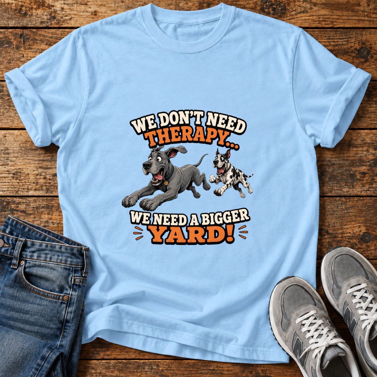Bigger Yard Great Dane graphic T-shirt in Light Blue, shown on a flat-lay shirt mockup