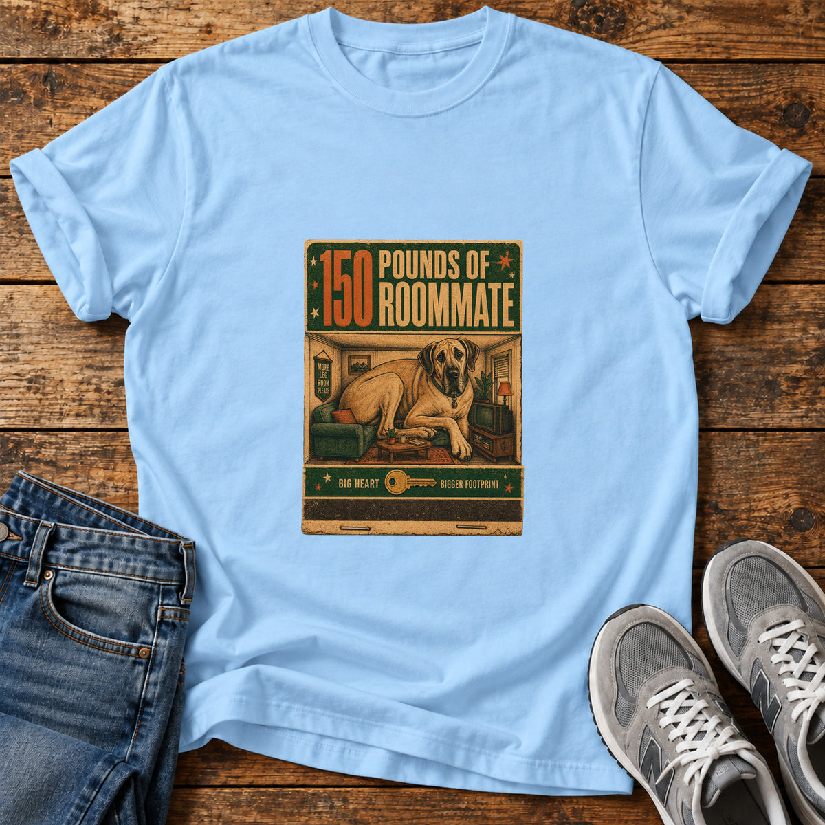 150 Pounds Roommate Great Dane graphic T-shirt in Light Blue, shown on a flat-lay shirt mockup
