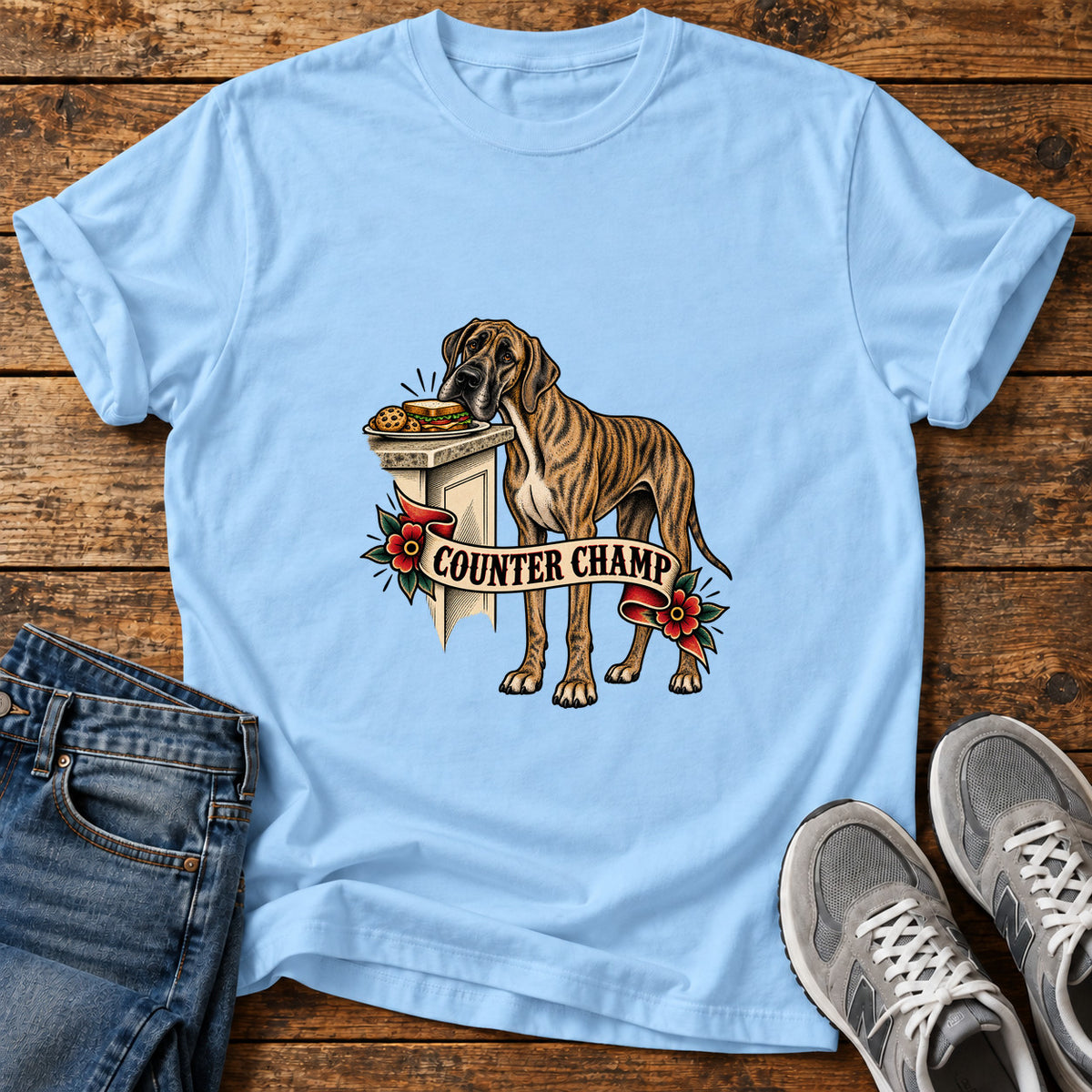 Counter Champ Great Dane graphic T-shirt in Light Blue, shown on a flat-lay shirt mockup