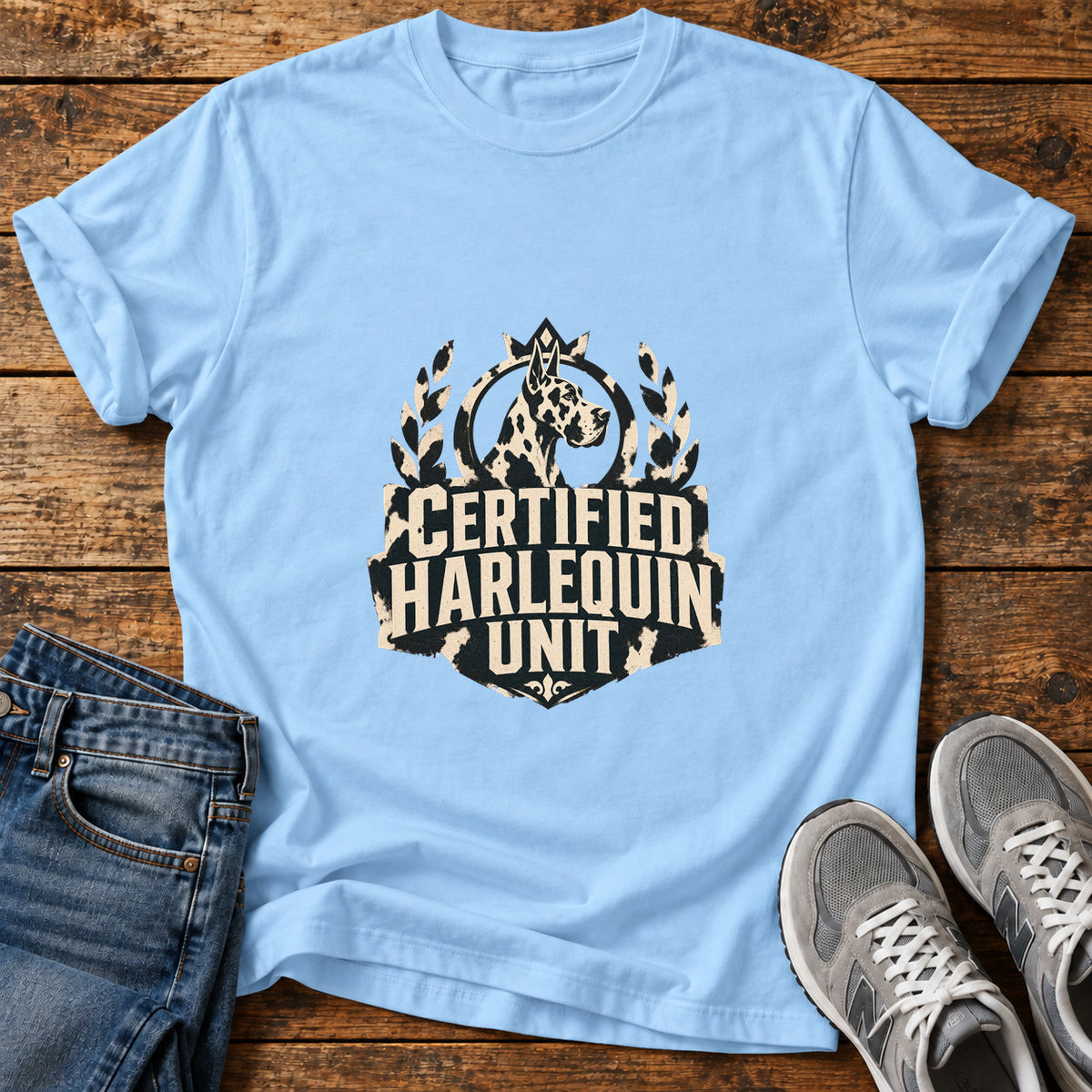 Certified Harlequin Great Dane graphic T-shirt in Light Blue, shown on a flat-lay shirt mockup