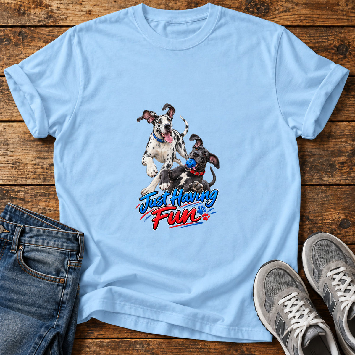 Just Having Fun Great Dane graphic T-shirt in Light Blue, shown on a flat-lay shirt mockup