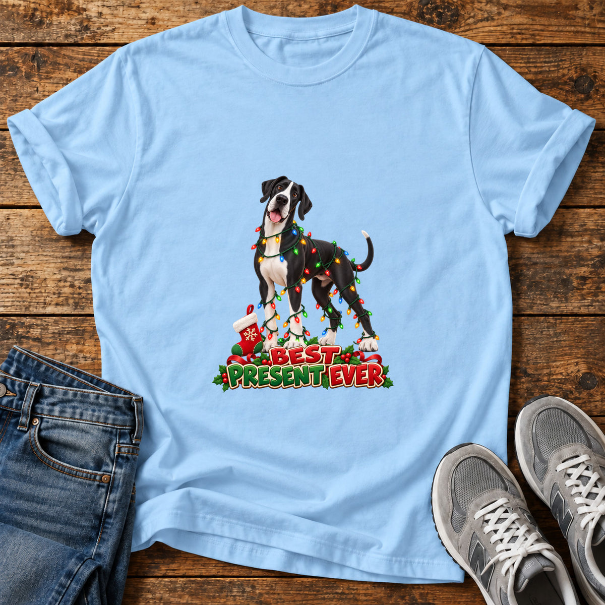 Best Present Ever Great Dane graphic T-shirt in Light Blue, shown on a flat-lay shirt mockup