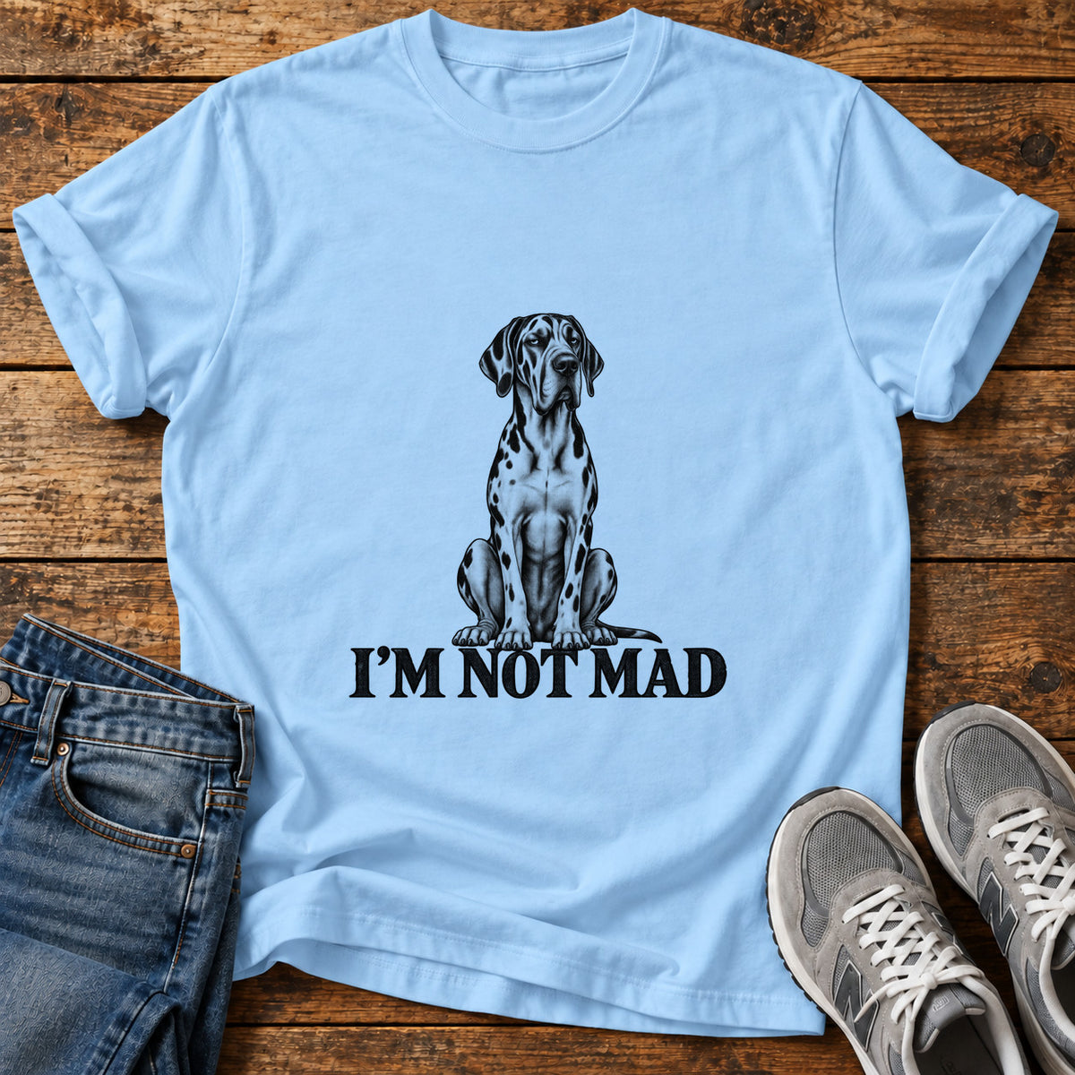 I'm Not Mad Great Dane graphic T-shirt in Light Blue, shown on a flat-lay shirt mockup