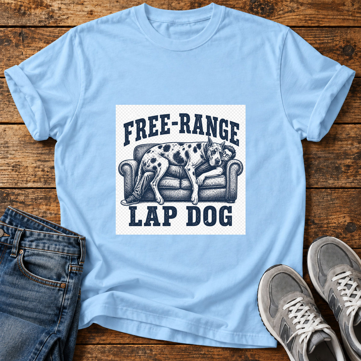 Free-Range Lap Dog Great Dane graphic T-shirt in Light Blue, shown on a flat-lay shirt mockup