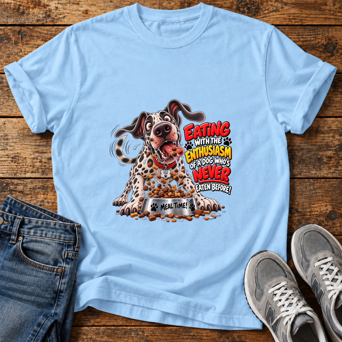 Eating Enthusiasm Great Dane graphic T-shirt in Light Blue, shown on a flat-lay shirt mockup