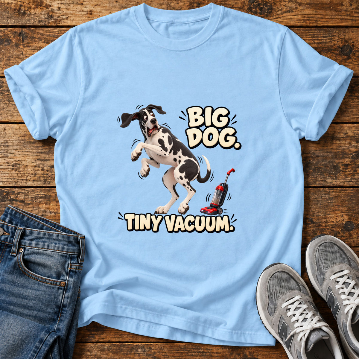 Big Dog Vacuum Great Dane graphic T-shirt in Light Blue, shown on a flat-lay shirt mockup