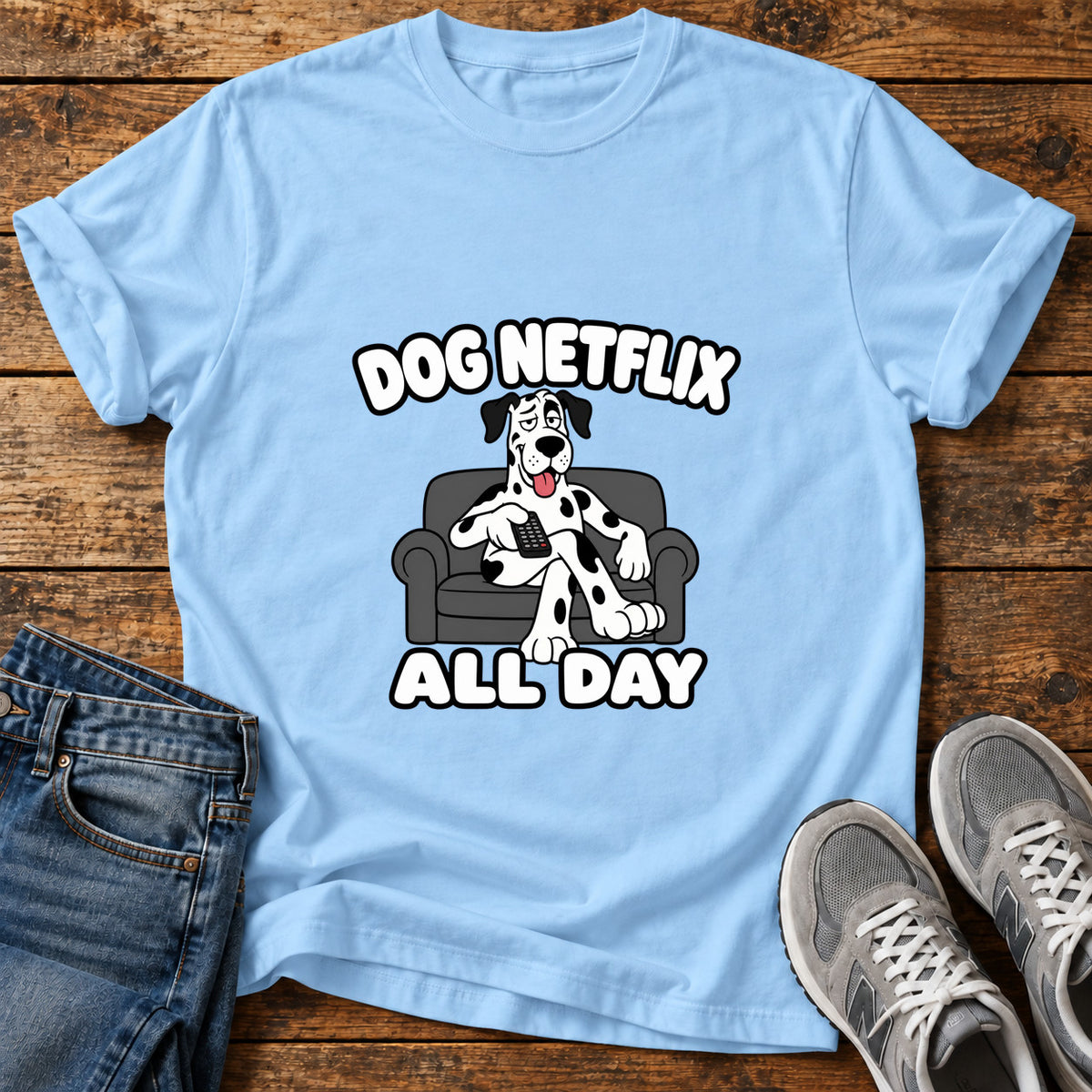 Dog Netflix Day Great Dane graphic T-shirt in Light Blue, shown on a flat-lay shirt mockup