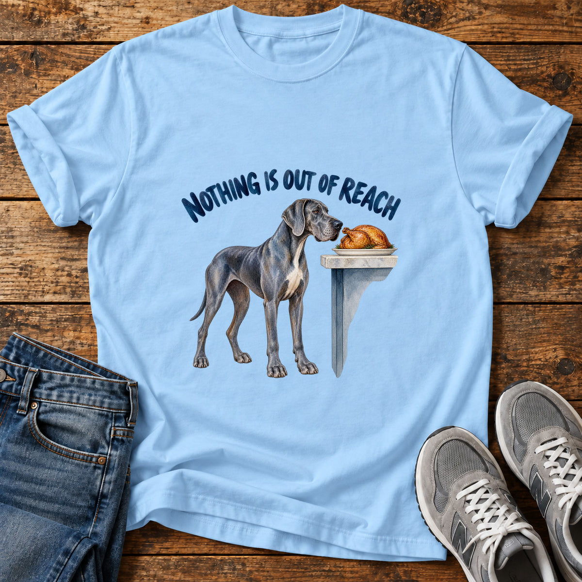 Nothing Out Reach Great Dane graphic T-shirt in Light Blue, shown on a flat-lay shirt mockup