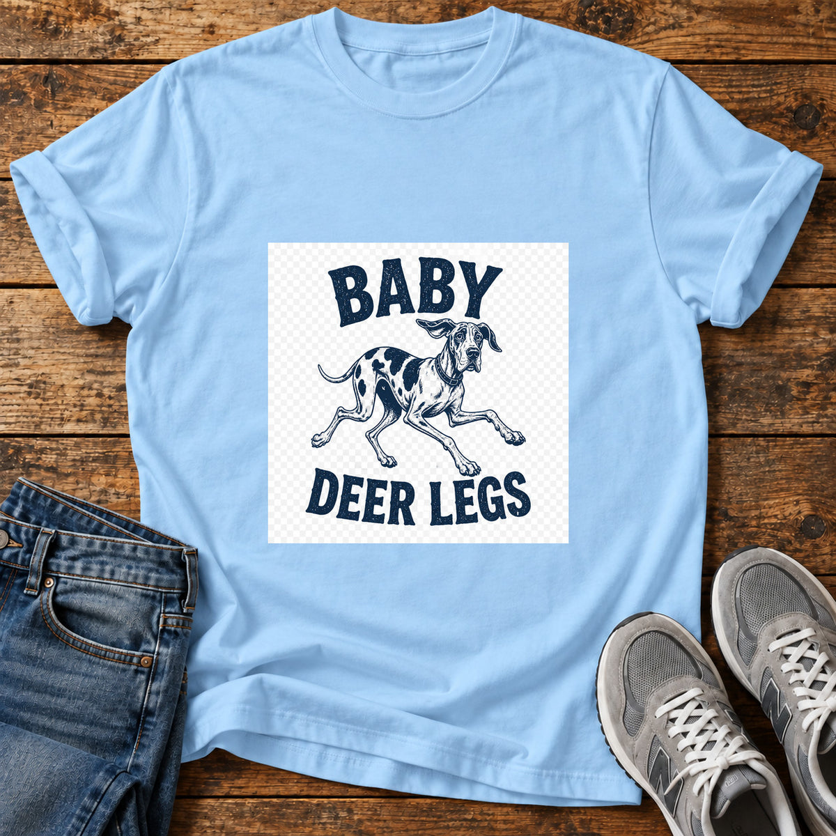 Baby Deer Legs Great Dane graphic T-shirt in Light Blue, shown on a flat-lay shirt mockup