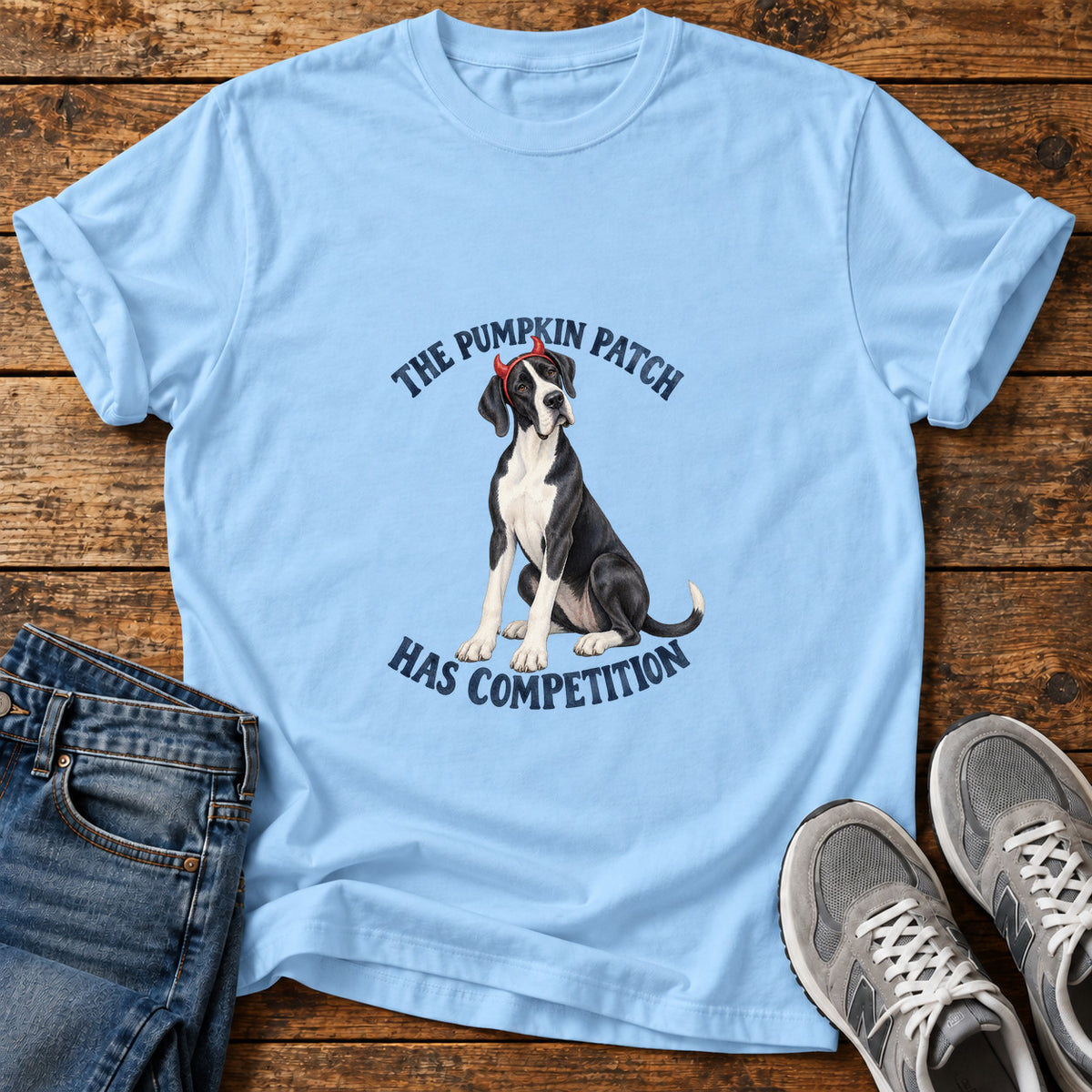 Pumpkin Patch Competition Great Dane graphic T-shirt in Light Blue, shown on a flat-lay shirt mockup