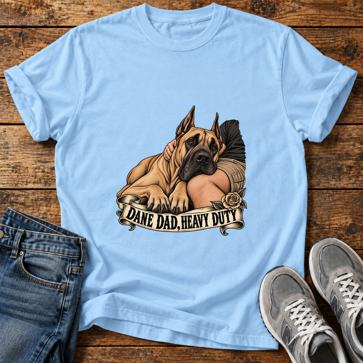 Dane Dad Duty Great Dane graphic T-shirt in Light Blue, shown on a flat-lay shirt mockup