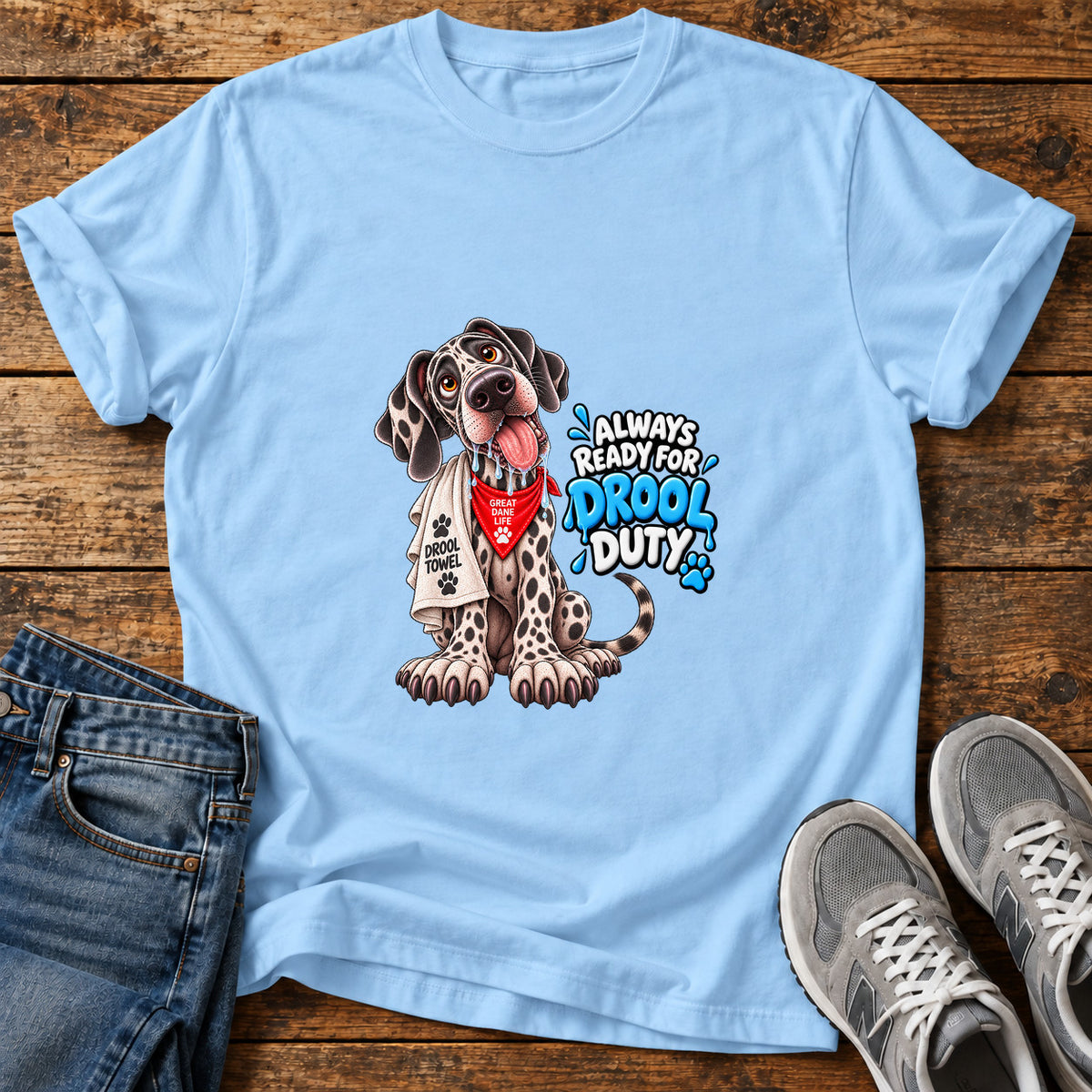 Drool Duty Great Dane graphic T-shirt in Light Blue, shown on a flat-lay shirt mockup