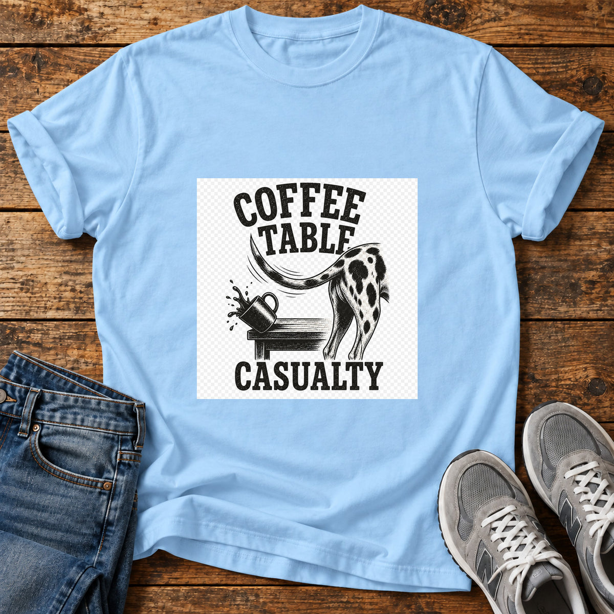 Coffee Table Mischief Great Dane graphic T-shirt in Light Blue, shown on a flat-lay shirt mockup